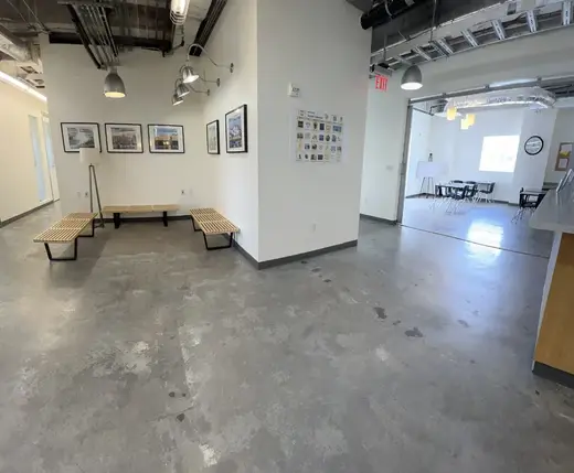 Spacious common area with seating at OHC Miami, a sober living home in Miami.