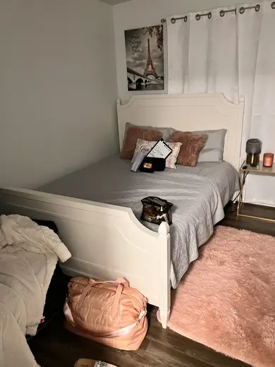 Cozy bedroom with plush bedding at Nisy Recovery Service, a sober living home in Miami.