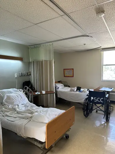 Shared bedroom with two beds at Palmetto Subacute Care Center, a sober living home in Miami.