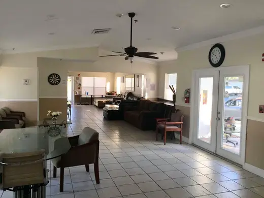 Spacious common area with seating at Blue Waters Recovery Foundation, a sober living home in Miami.